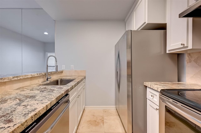 kitchen featuring white cabinets, appliances with stainless steel finishes, ventilation hood, and sink