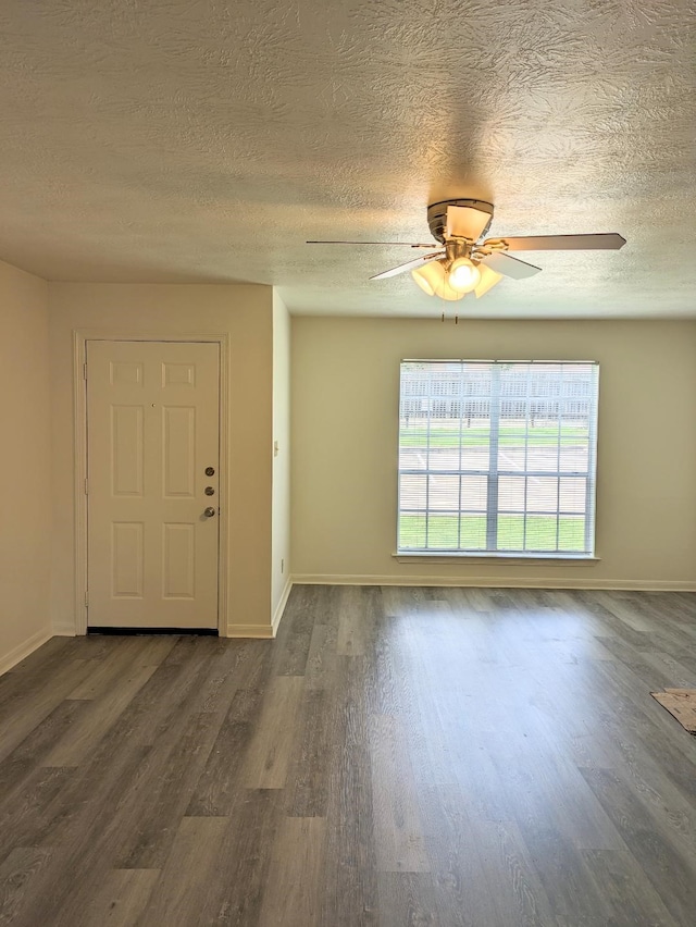 entrance foyer with a textured ceiling, dark hardwood / wood-style floors, and ceiling fan