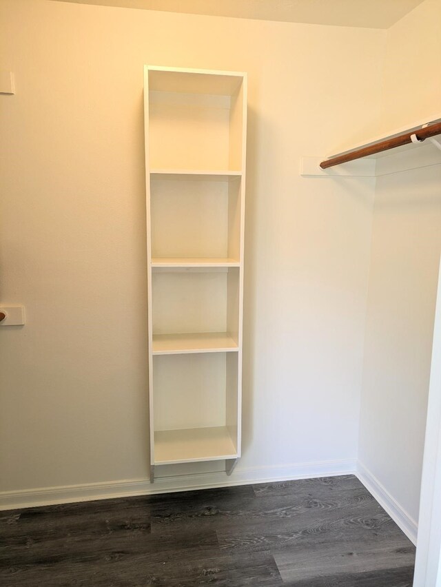 2300 Stone Hollow Dr, Brenham, TX 77833 - spacious closet with dark wood-style floors
