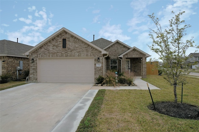 view of front of property featuring a front lawn and a garage