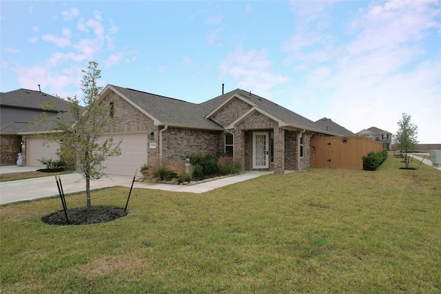 single story home featuring a front lawn and a garage