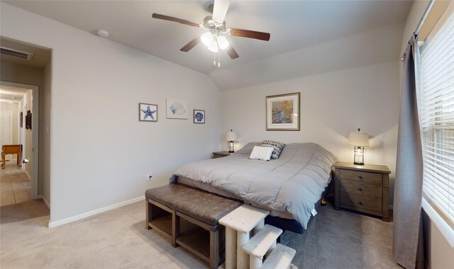 carpeted bedroom featuring ceiling fan and lofted ceiling