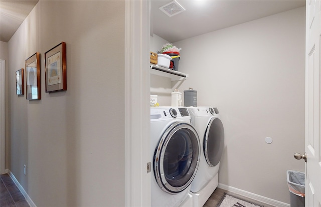 laundry room with washing machine and clothes dryer