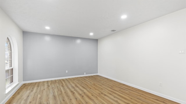 empty room with light hardwood / wood-style floors