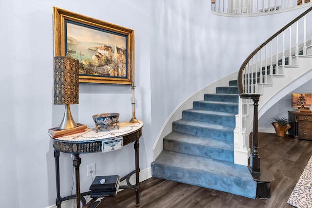 stairway featuring hardwood / wood-style flooring