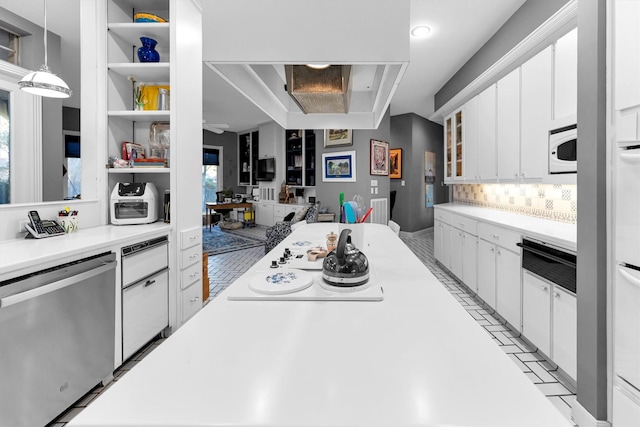 kitchen featuring tasteful backsplash, white cabinetry, dishwasher, and pendant lighting