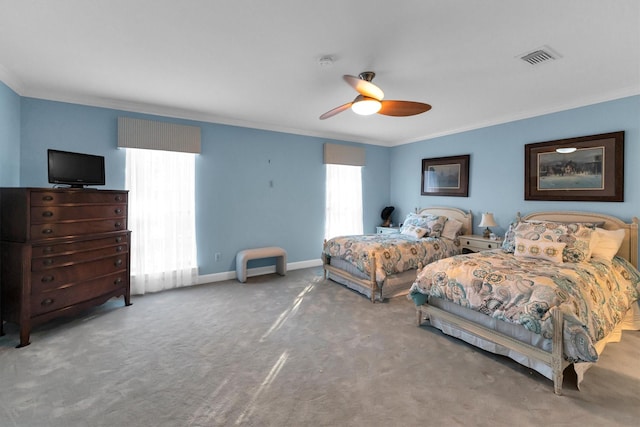 carpeted bedroom featuring ceiling fan, crown molding, and multiple windows