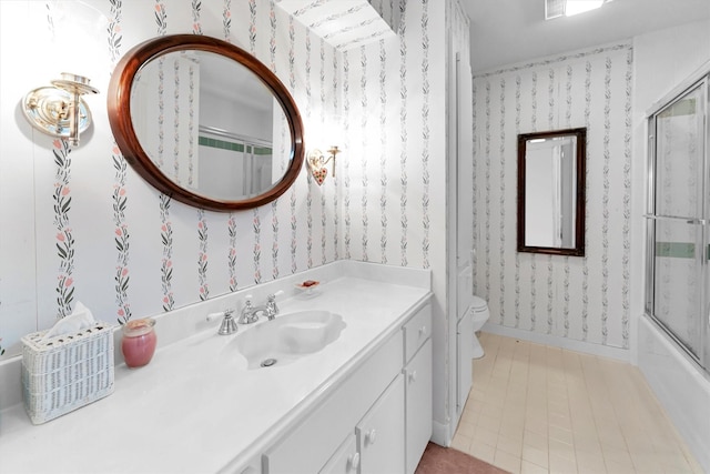 full bathroom with vanity, enclosed tub / shower combo, and toilet