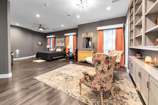 bedroom with dark hardwood / wood-style floors