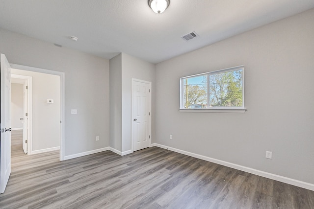 unfurnished bedroom featuring light wood-type flooring