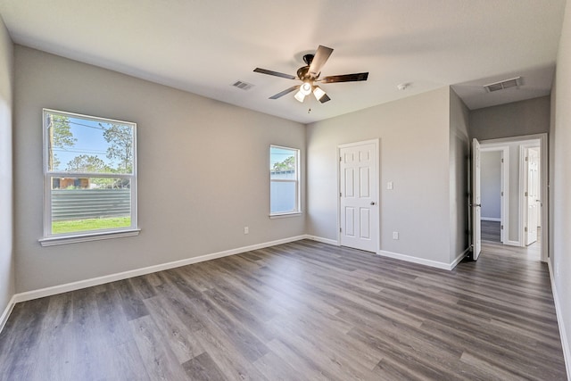 unfurnished bedroom with ceiling fan and wood-type flooring