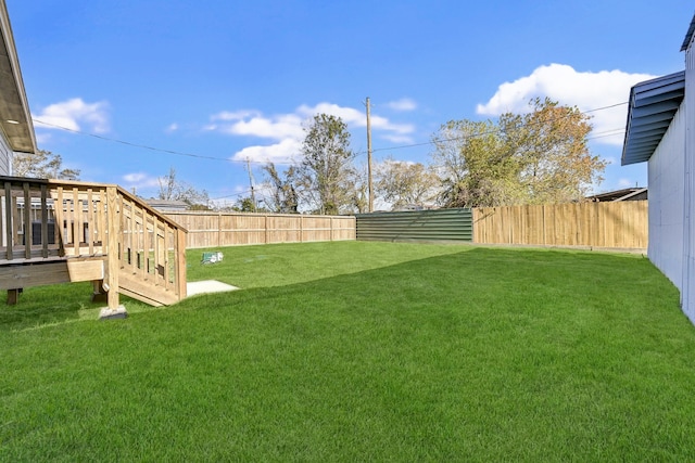 view of yard featuring a wooden deck