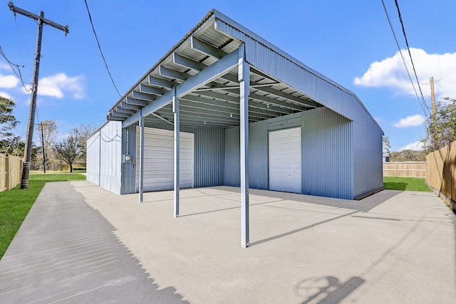 view of outbuilding with a carport and a garage