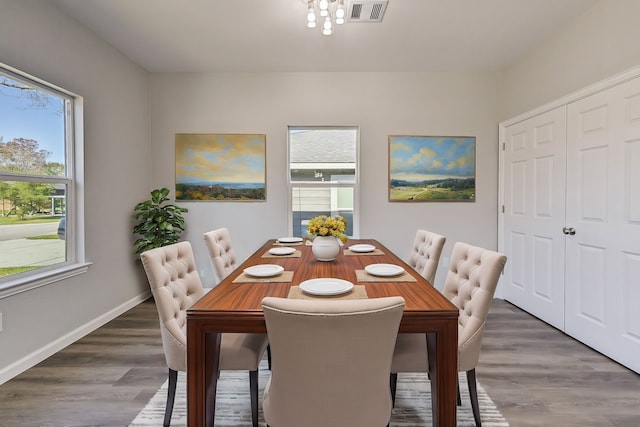 dining area featuring dark hardwood / wood-style flooring and a wealth of natural light