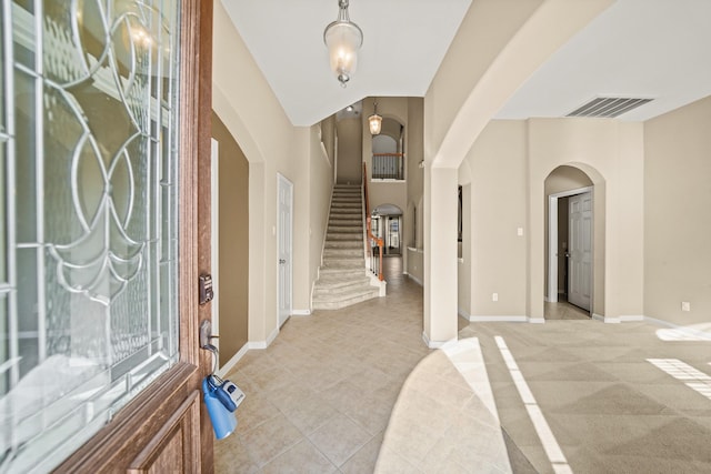 foyer with light carpet