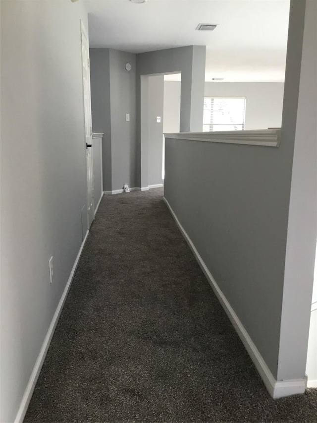 hallway with carpet