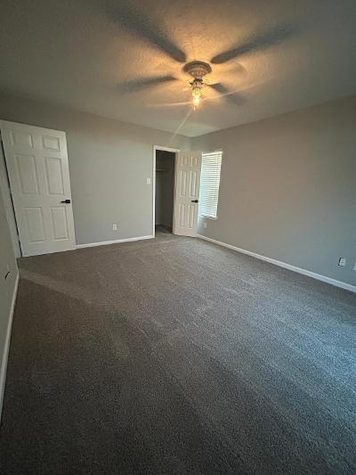 unfurnished bedroom with carpet and ceiling fan