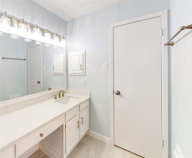 bathroom with vanity and tile patterned floors