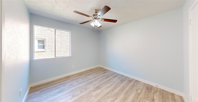 unfurnished room featuring a textured ceiling, light hardwood / wood-style flooring, and ceiling fan