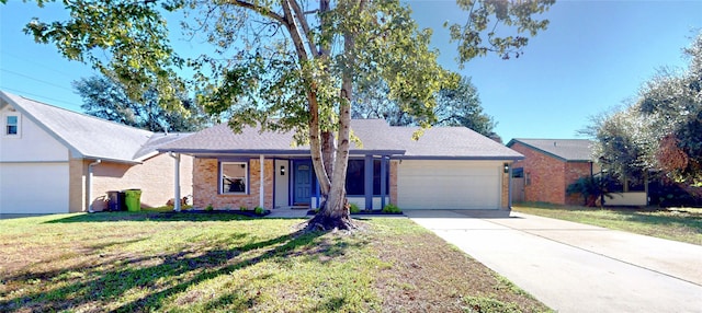 single story home with a front yard and a garage