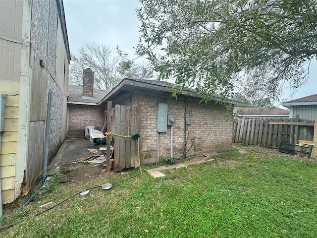 view of outdoor structure with a lawn