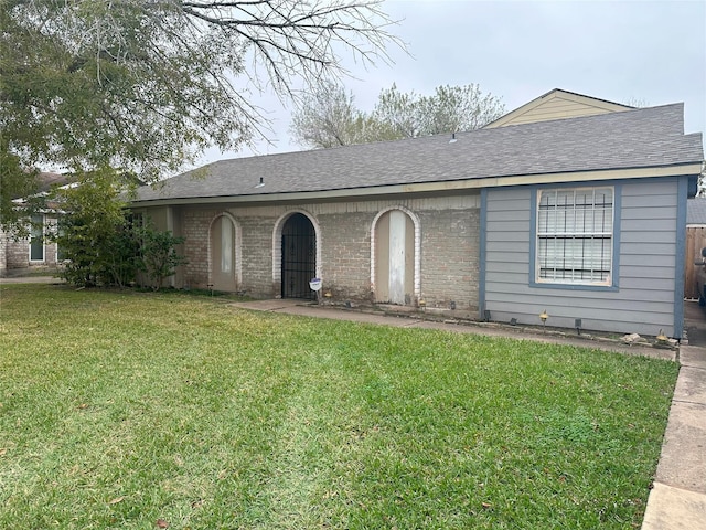 ranch-style house with a front lawn