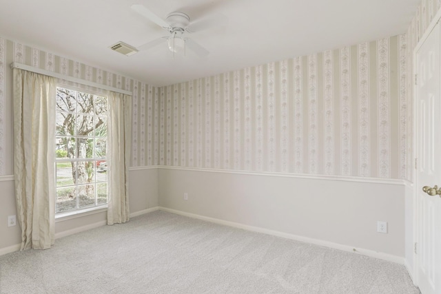 spare room with ceiling fan and carpet floors