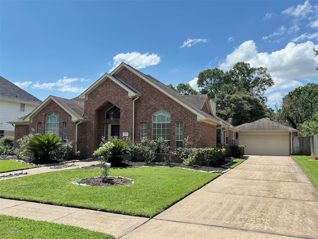 view of front of home with a garage and a front lawn