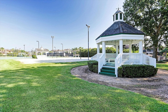 view of property's community with a gazebo and a lawn