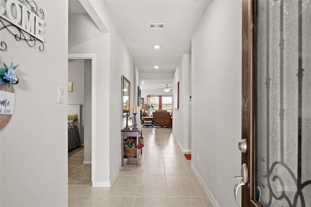 tiled foyer entrance with ceiling fan