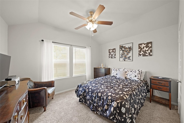 bedroom with light colored carpet, vaulted ceiling, and ceiling fan