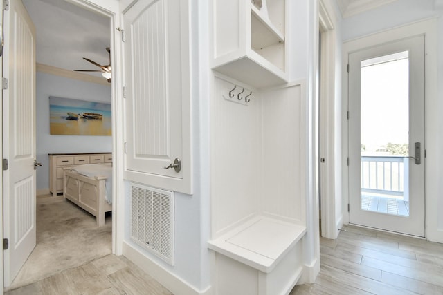 mudroom featuring light hardwood / wood-style flooring, ceiling fan, and crown molding