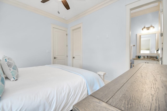 bedroom featuring ceiling fan, sink, and ornamental molding