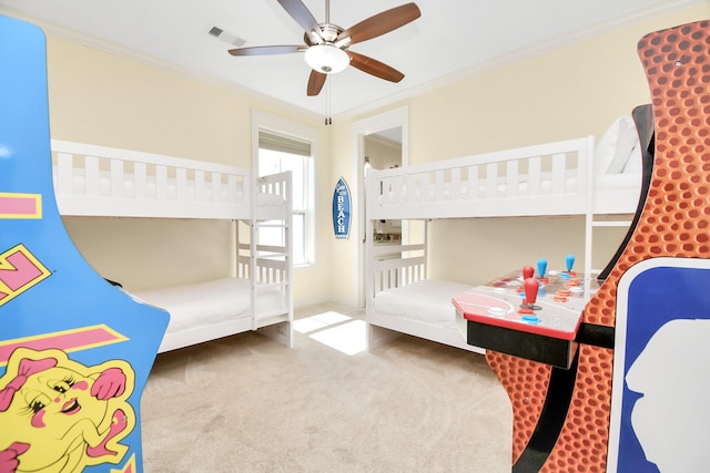 bedroom featuring carpet, ceiling fan, and ornamental molding