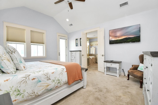 bedroom featuring connected bathroom, ceiling fan, light carpet, and vaulted ceiling