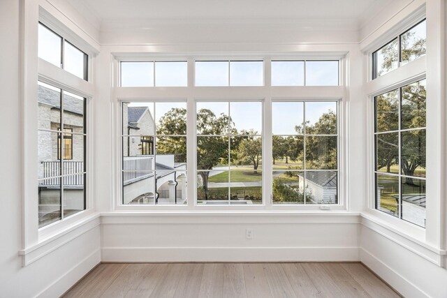 unfurnished sunroom with a wealth of natural light