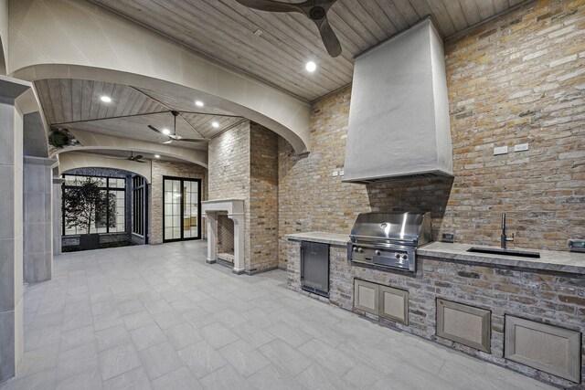 view of patio featuring grilling area, ceiling fan, sink, and an outdoor kitchen