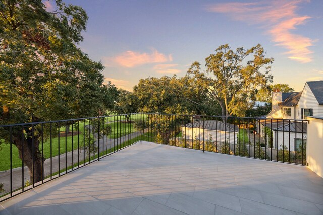 view of patio terrace at dusk