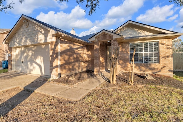 ranch-style house featuring a garage