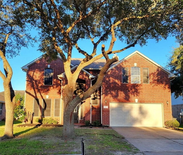 view of front facade featuring a front lawn and a garage