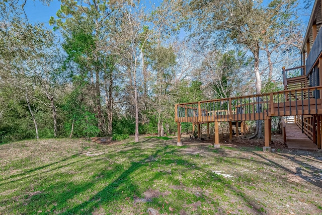 view of yard with a wooden deck