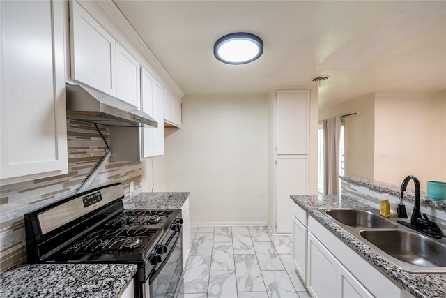 kitchen with black gas range, backsplash, white cabinetry, and sink