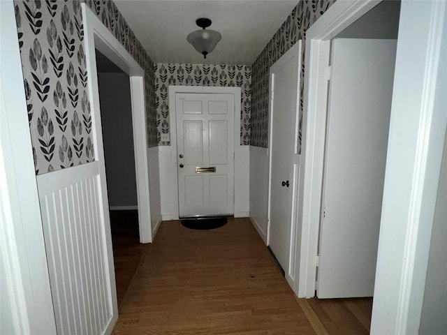 corridor with wood-type flooring