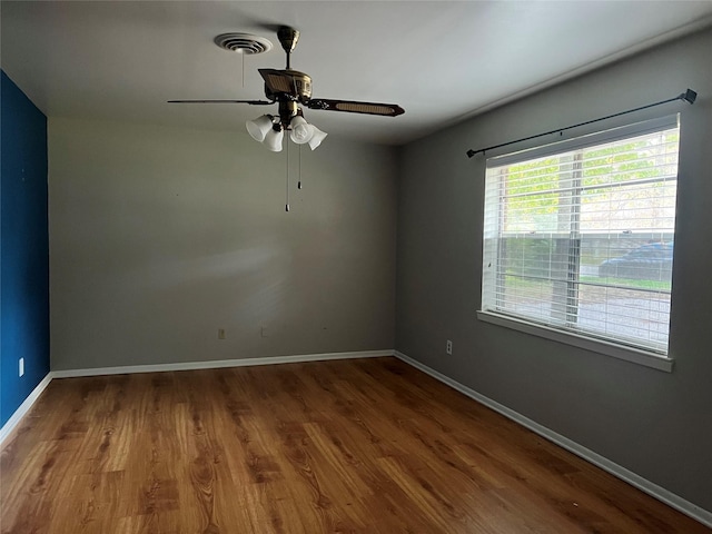 unfurnished room featuring ceiling fan and wood-type flooring