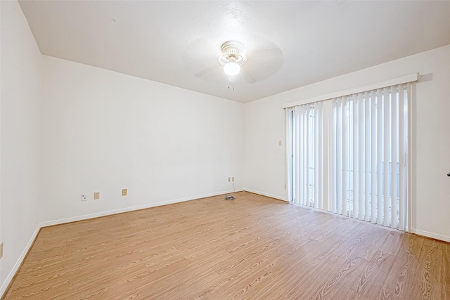 spare room with light hardwood / wood-style floors and ceiling fan