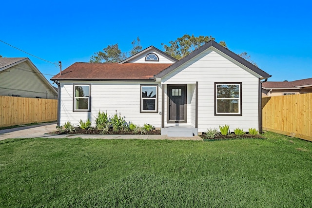 view of front of property with a front lawn