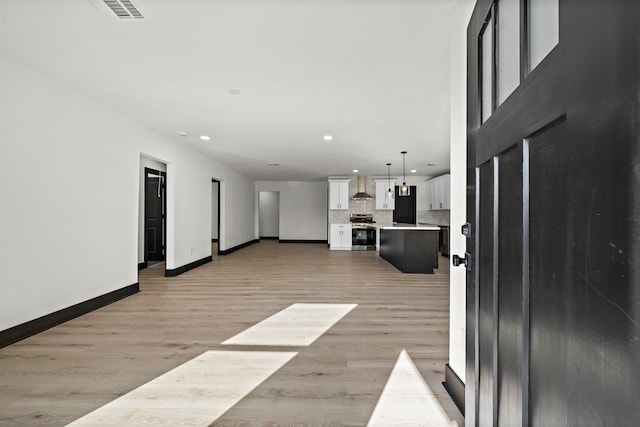 unfurnished living room featuring light hardwood / wood-style flooring