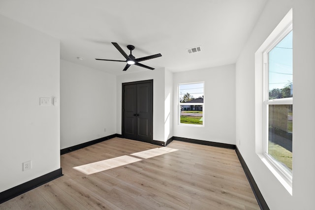 unfurnished room featuring ceiling fan and light hardwood / wood-style floors