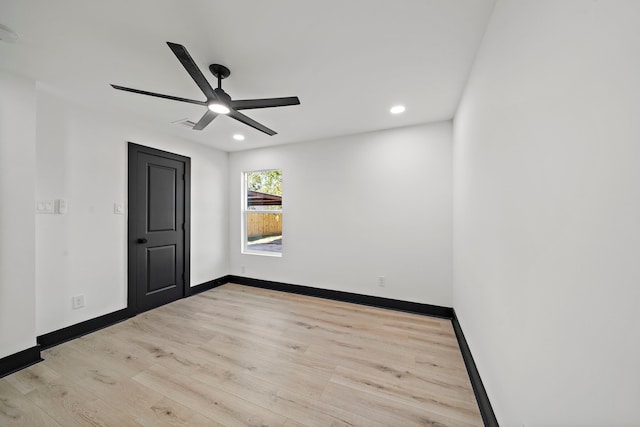 spare room with ceiling fan and light hardwood / wood-style flooring