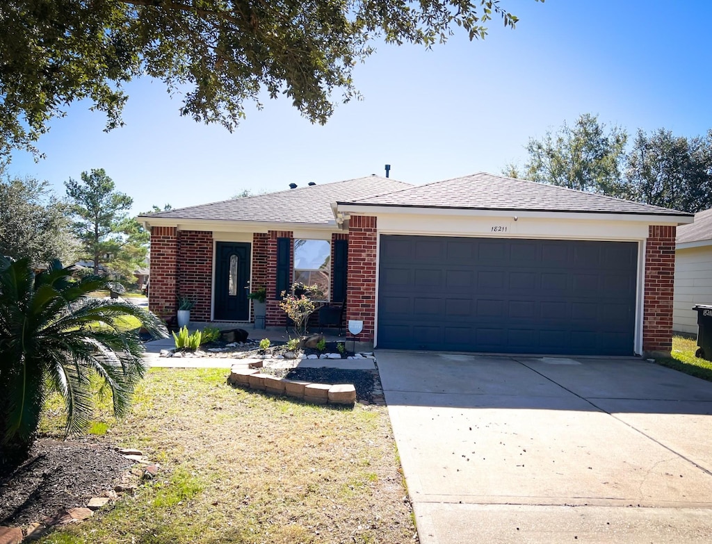 ranch-style home featuring a garage